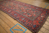 Main border of an antique Northwest Persian runner, featuring interconnected paisley boteh and vine motifs.