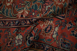 Close-up of Northwest Persian runner's cherry red abrashed ground, floral bouquets, blue paisley boteh.
