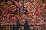 Close-up of the even, low pile on a vintage Heriz rug showing its bold geometric pattern.