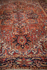 Angled perspective on a vintage Heriz rug highlighting its bold geometric pattern and low pile.