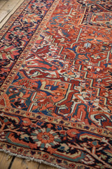 Low, even pile and intricate geometric patterns of a vintage hand-knotted Heriz carpet.