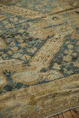 Time-softened texture of a distressed Kurdish carpet with wear down to the knot heads.