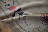 Antique Art Deco rug pile, with delicate navy blue vine and blush rose on ivory.