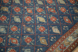 Antique Kurdish carpet's trellis pattern with individual panels of boteh and floral motifs.