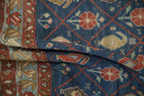 A soft fold reveals the textured pile of a Kurdish carpet with floral and boteh motifs.