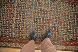 Close perspective showing the knot heads and allover floral design of an antique Qashqai runner.