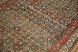 Detail of the antique Persian Qashqai's allover floral field showing mostly even, time-softened wear.