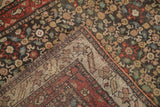Hand-knotted foundation and colorful wool pile of an antique Qashqai rug runner.