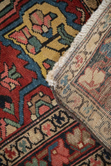The hand-knotted construction of a vintage Baktiari rug, showing the colorful pile and tightly woven back.