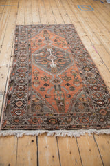 Distressed hexagonal medallion and floral patterns of Hamadan rug in chestnut and oxidized silver.