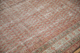 Distressed Malayer carpet, ruby red botehs on dusty blue field, with aged texture and patterned border.