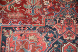 Sophisticated floral arabesques, sickle leaves on vintage Ahar in brick red, navy.