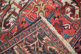Intricate floral arabesques and short pile on a vintage Ahar carpet corner.