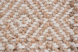 Natural hand-woven jute rug with beige and off-white diamond pattern weave.