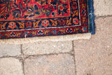 Antique Kashan's fine fringe, royal blue and rich red border, with visible white knots.