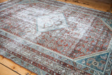 Textural detail of distressed vintage Malayer rug, blanched silver, teal, and slate blue.