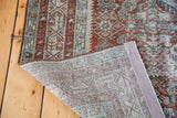 Distressed Malayer rug's hand-knotted foundation and blanched pile with teal, rust tones.