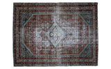Distressed Malayer rug featuring faded red, silver, and teal geometric medallion, 4'7