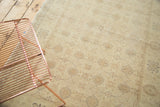 Traditional hand-knotted vintage Sivas rug with intricate interlaced palmettes in soft gold.