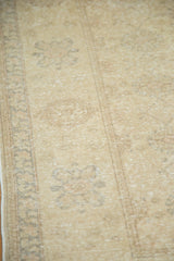Vintage Sivas rug in soft gold, beige, and gray, featuring interlaced palmette detail.
