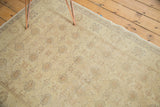 Soft gold Sivas rug with muted gray and sand interlaced palmette motifs.