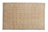 Vintage Sivas rug, allover interlaced palmette pattern, soft gold and muted beige tones.