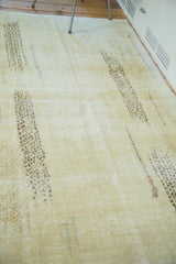 Abstract Turkish Oushak rug with distressed lemon ivory and modern brown lines.