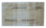 Vintage distressed Oushak rug with abstract modern design lines and light lemon ivory tones.
