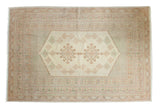 Vintage Oushak carpet featuring delicate pastel peach, green, and cream geometric motifs, 6'2