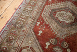 Vintage Oushak runner showcasing soft silver-grey and ivory geometric border with rusty bronze.