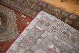 Vintage Oushak runner corner, revealing soft silver-grey and ivory geometric border weave.