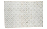 Blanched distressed Oushak carpet with muted green clover lattice design, 7'3