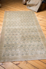 Allover tone-on-tone slate beige and muted blue design on the vintage Oushak runner.