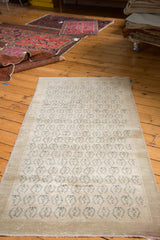 Vintage Oushak runner's corner detailing allover slate blue motifs on beige.