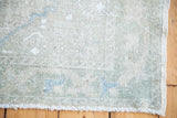 Airy blanched pile of vintage Oushak rug with light ivory and powder blue.