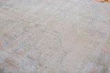 Textured, blanched pile of a distressed vintage Oushak rug.