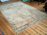 Vintage Oushak carpet's high sheen pile with beige, soft bronze, and subtle pink hues.