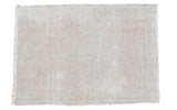 Distressed Oushak rug with faded neutral palette and worn pile texture, 2'6