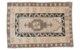 Geometric vintage Oushak rug in beige, brown, and muted blue tones, 3'2