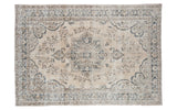 Vintage Oushak carpet with a blanched beige field, faded blue medallion, contrasting floral patterns, 7'3
