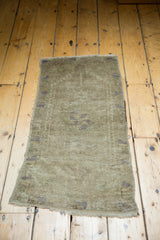 Soft-pile Vintage Oushak rug displaying muted grey tones, subtle geometric pattern, and short fringe.