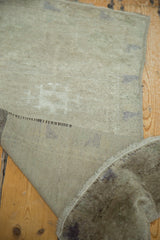 Hand-knotted foundation and soft grey pile texture of a vintage Oushak rug.