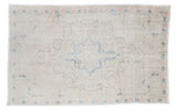 Light, airy distressed Oushak rug with soft beige, faded blue and pink traditional patterns, 4'7