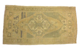 Vintage Oushak runner: muted sage green and beige geometric design with subtle abrash.