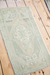 Soft, subtle green and beige geometric pattern with abrash on vintage Oushak runner.