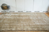 Distressed vintage Persian Serbend carpet with faded ivory and charcoal boteh pattern.