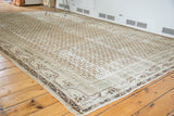 Distressed vintage Persian Serbend carpet, faded ivory and charcoal repeating boteh pattern.