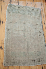 Worn texture of the bottom right corner with blanched silver and sea foam tones.