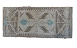 Vintage Turkish Oushak runner featuring geometric serrated leaf medallion in silver, charcoal, ice blue tones.
