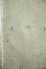 Blanched ivory and beige pile texture with subtle charcoal geometric motifs.